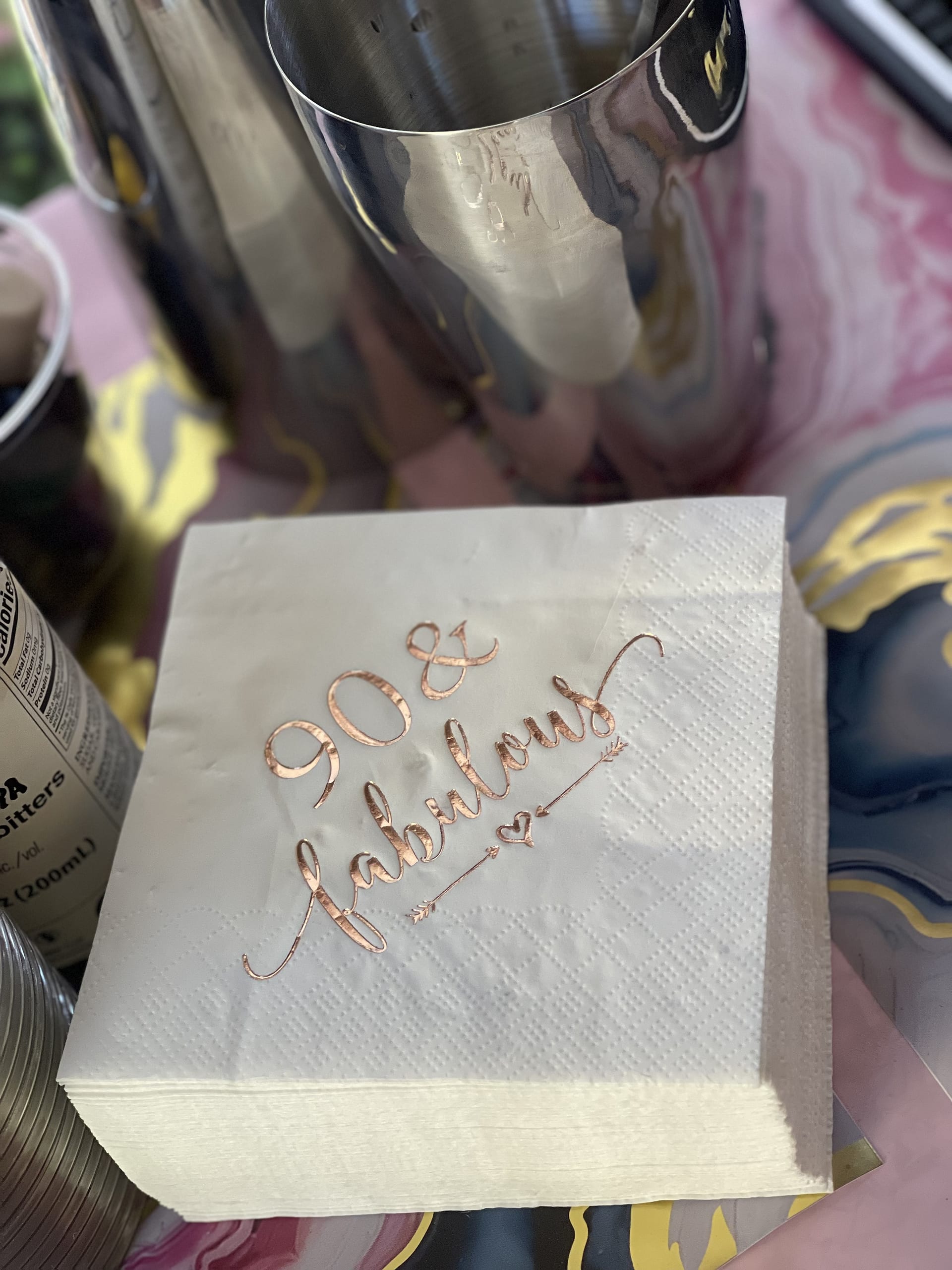 Custom printed napkins and cocktail shakers on the bar